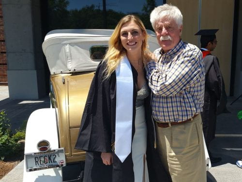 Heather Johnston and Jerry McTier standing in front of the Reck on her graduation day.