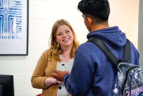 A Georgia Tech admissions counselor smiles as she talks to a student.
